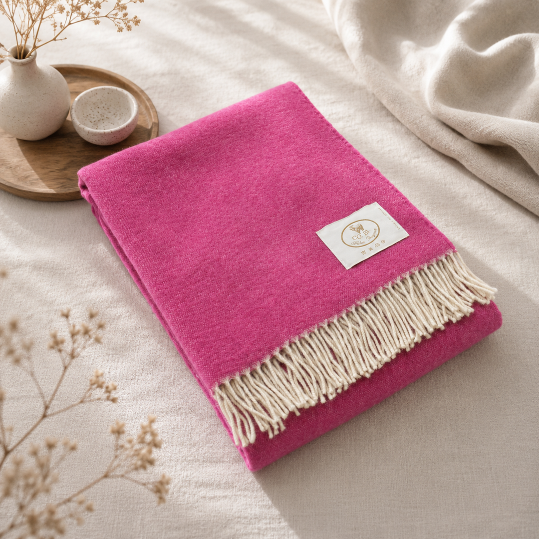 Plaid fucsia con frange bianche