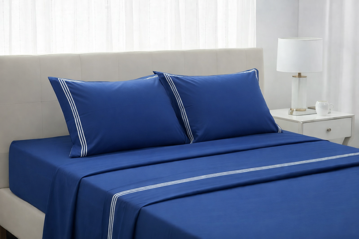 Lenzuola cotone percalle blu con triplo cordonetto bianco