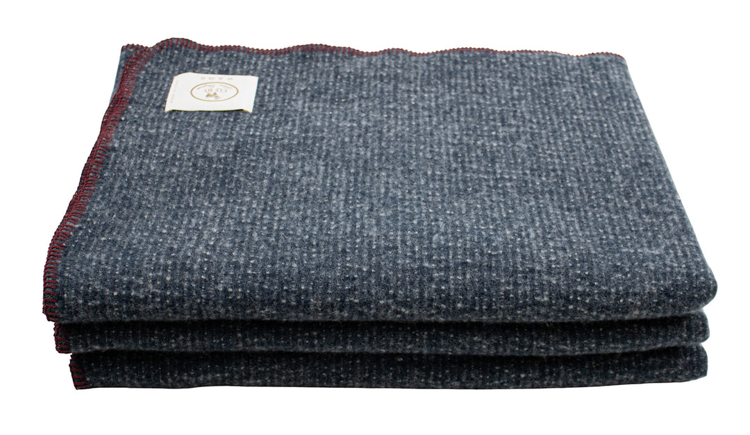 Coperta blu scuro con bordo punto cavallo bordeaux