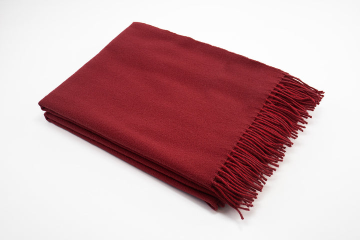 Plaid rosso di pura lana con frange