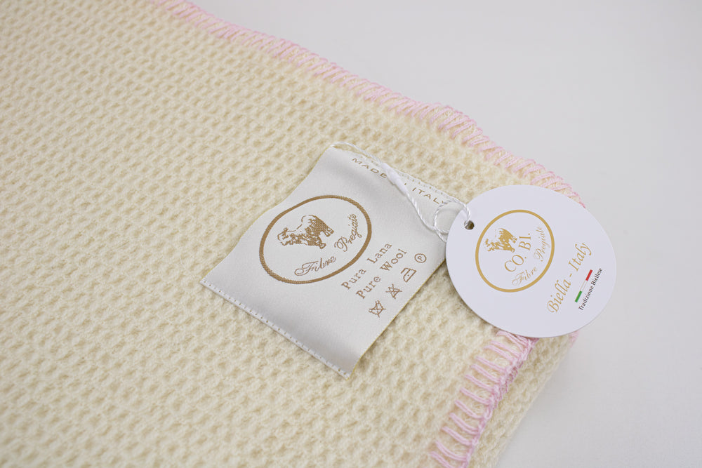 Etichetta plaid di lana con bordo rosa a punto cavallo