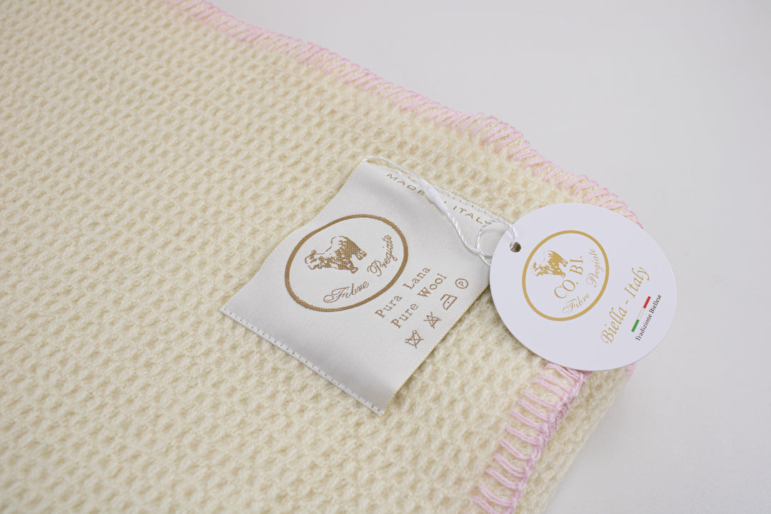 Etichetta plaid di lana con bordo rosa a punto cavallo