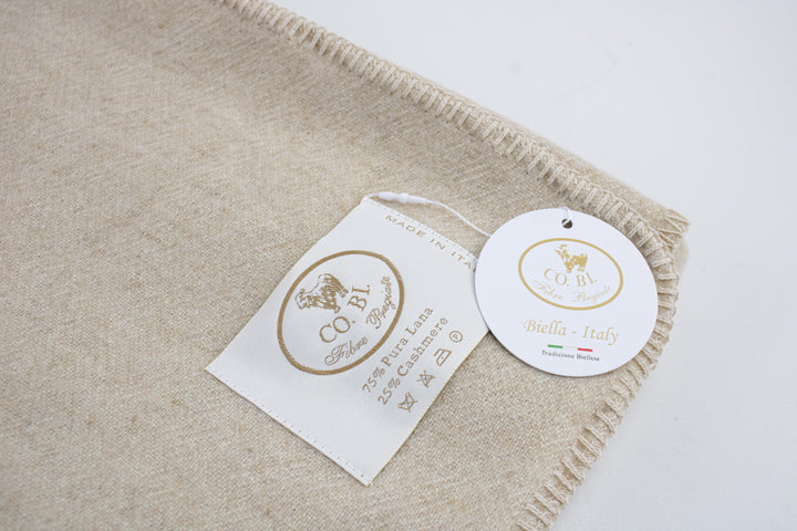 Particolare plaid beige a punto cavallo