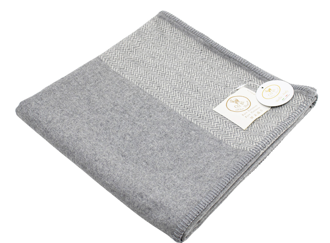Copertina per culla grigio con motivo chevron in cashmere